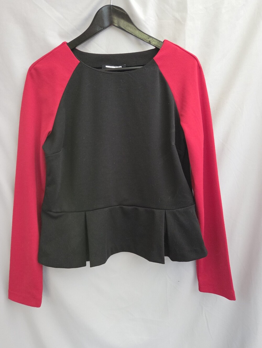 Black Peplum Sweatshirt with Red Raglan Sleeves